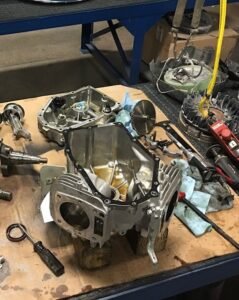 Technician performing a concrete equipment gearbox rebuild and drive system repair in Metro Atlanta.