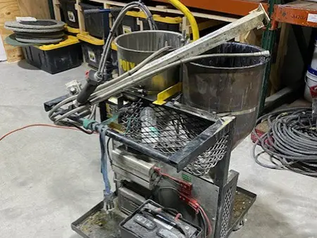 Concrete joint filler application machine used to repair and fill commercial concrete floor joints.