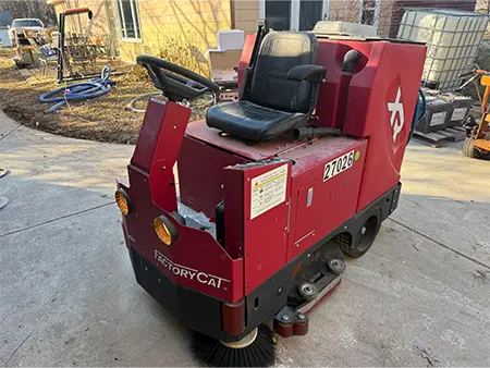 Ride-on commercial floor scrubber used in industrial facilities and serviced by Loyd's Equipment Repair in Metro Atlanta